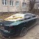 Наслідки негоди в Луцьку: дах злетів і впав на машину. ФОТО