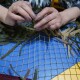 «Не можемо виготовити кулі. Тому плетемо сітки»:  як у Луцьку створюють захист для воїнів та техніки